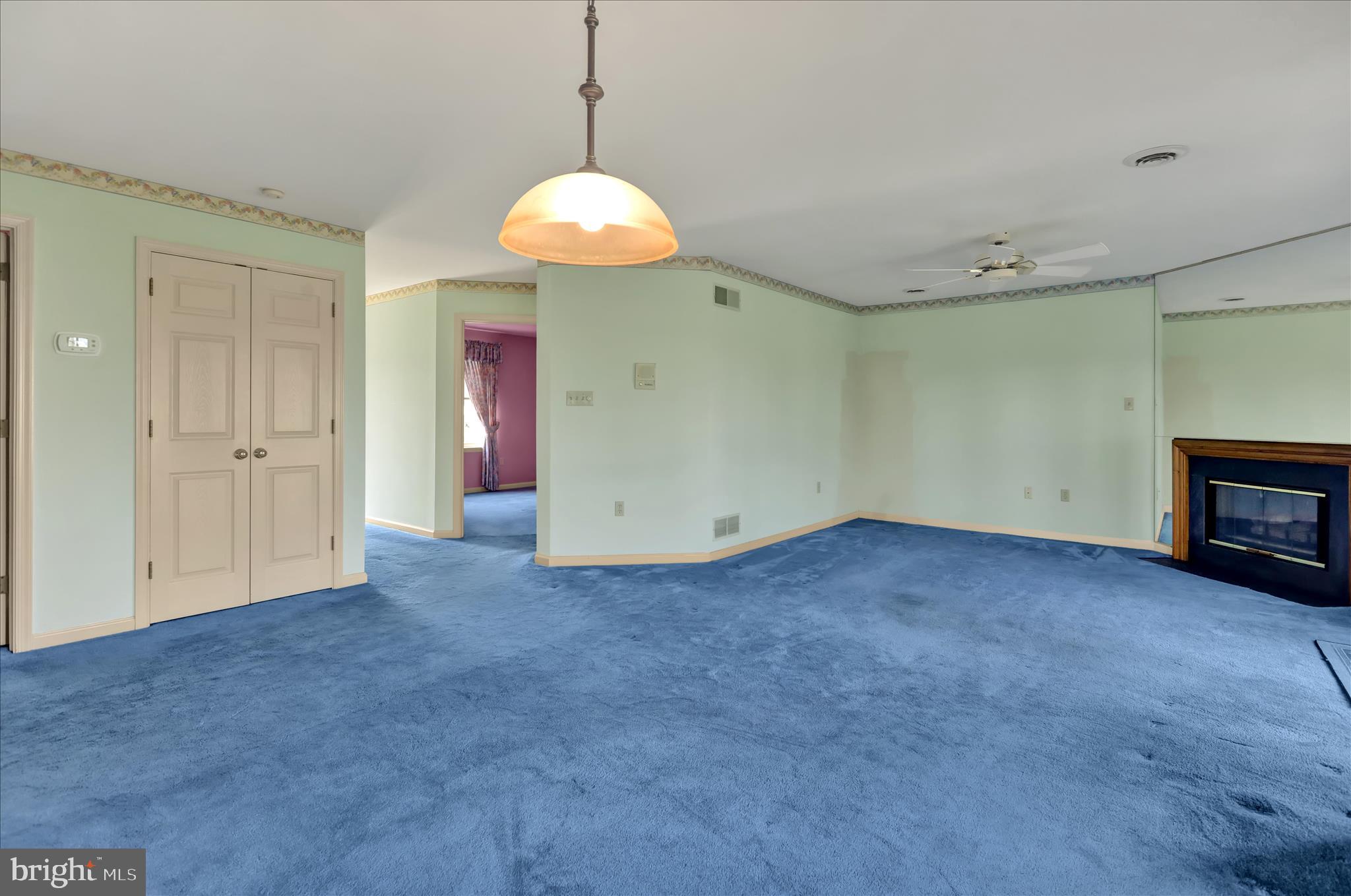 146 Heather Lane Reading, PA 19610 - Photo 7 of 25 a view of empty room with cabinet and fireplace