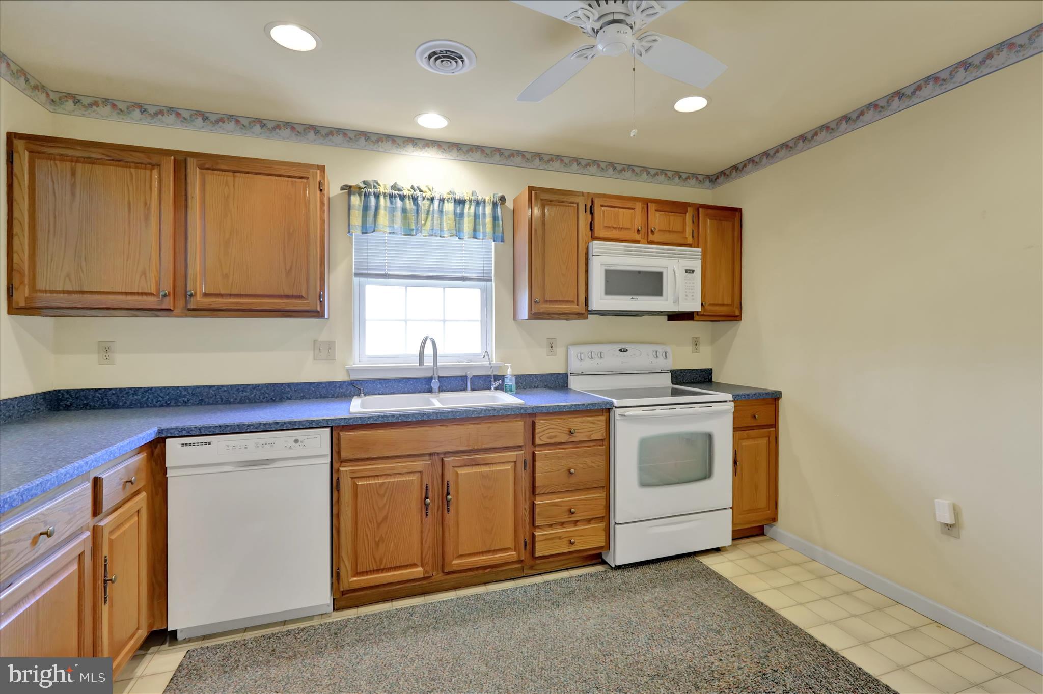 146 Heather Lane Reading, PA 19610 - Photo 9 of 25 a kitchen with a sink stove and cabinets