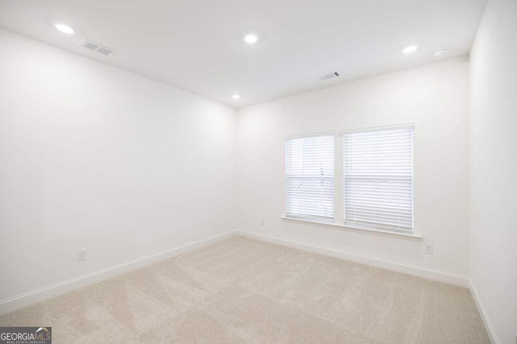 108 Palmetto Avenue Perry, GA 31069 - Photo 16 of 30 an empty room with a window