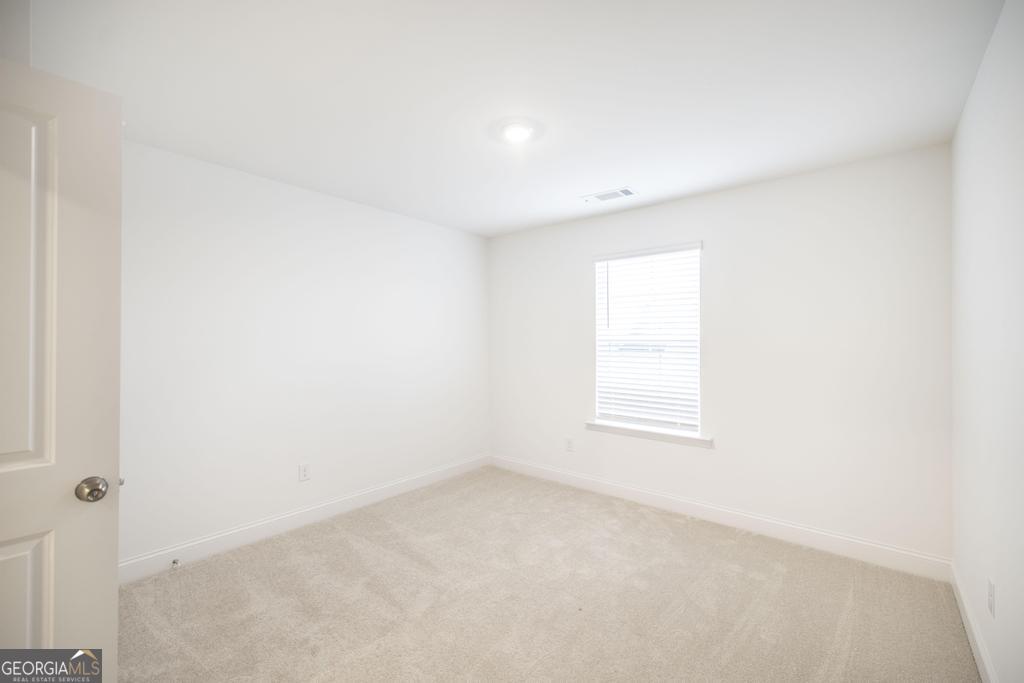 108 Palmetto Avenue Perry, GA 31069 - Photo 23 of 30 an empty room with a window