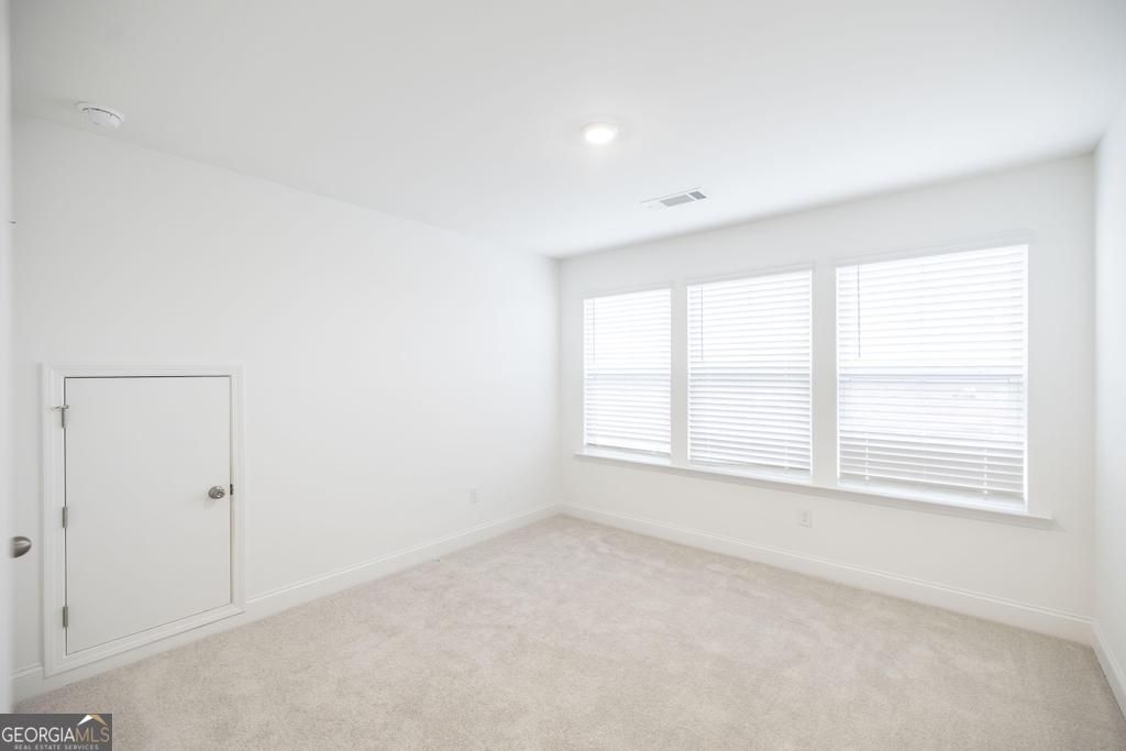 108 Palmetto Avenue Perry, GA 31069 - Photo 26 of 30 an empty room with a window