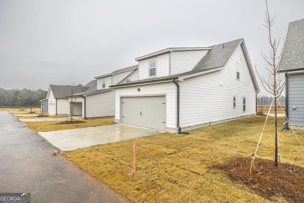 108 Palmetto Avenue Perry, GA 31069 - Photo 28 of 30 a view of a house with a backyard