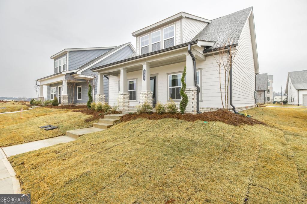 108 Palmetto Avenue Perry, GA 31069 - Photo 3 of 30 a view of a house with a swimming pool