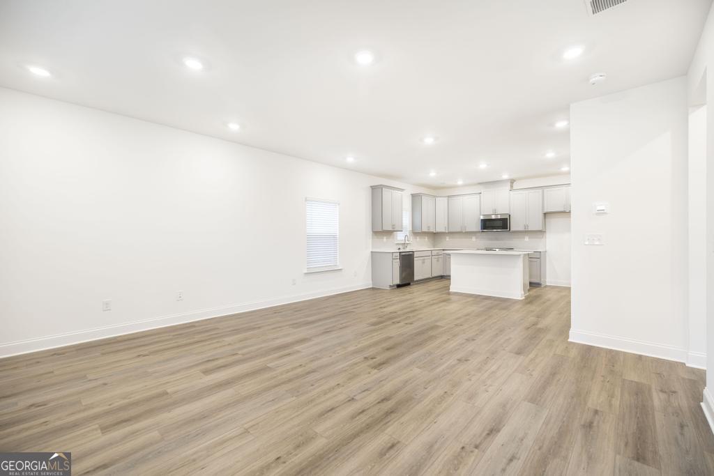 108 Palmetto Avenue Perry, GA 31069 - Photo 5 of 30 a view of kitchen with wooden floor