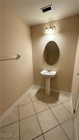 a kitchen with stainless steel appliances granite countertop a refrigerator and a stove