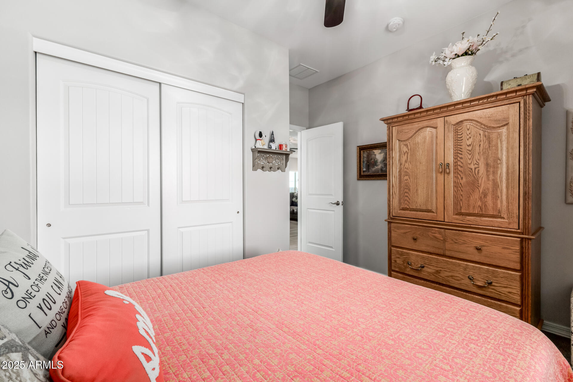 614 North Tomahawk Road Apache Junction, AZ 85119 - Photo 19 of 48 a bedroom with a bed and a closet