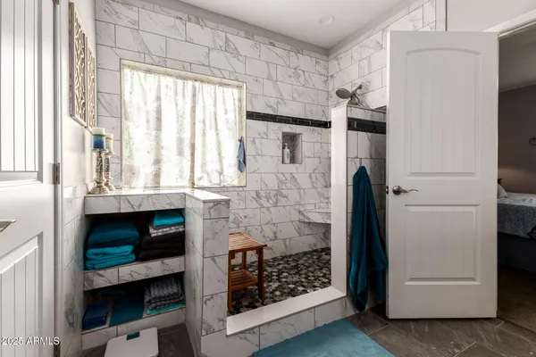 a bathroom with a shower and a fireplace