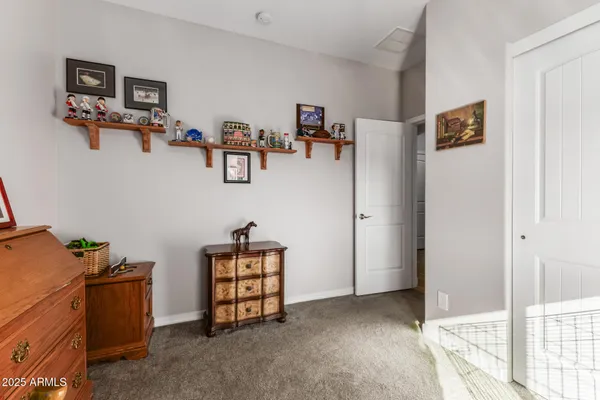 a view of room with window and furniture