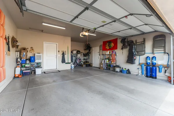 a view of a garage with rack and bicycle