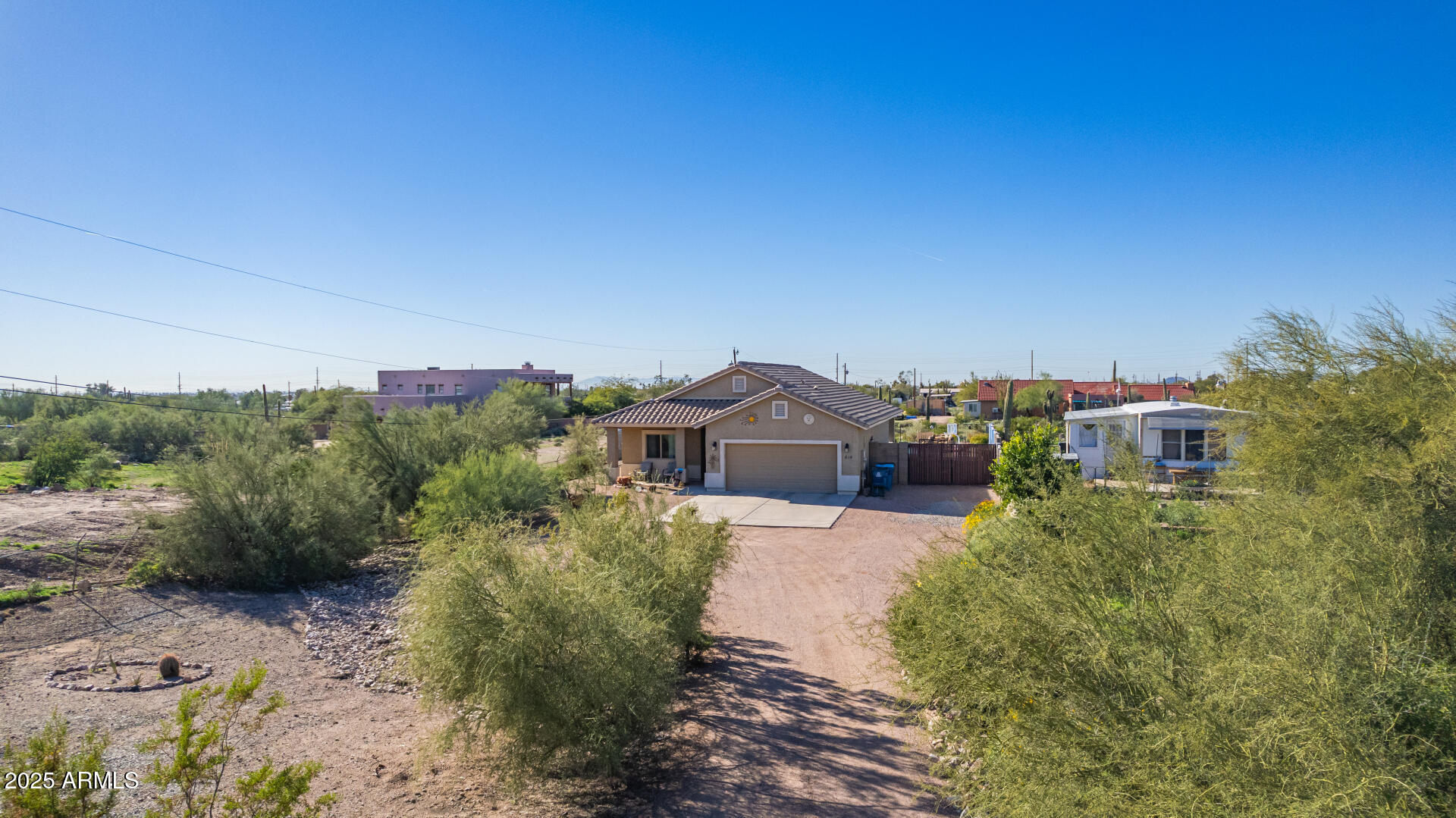 614 North Tomahawk Road Apache Junction, AZ 85119 - Photo 38 of 48 a view of a house with a yard and plants