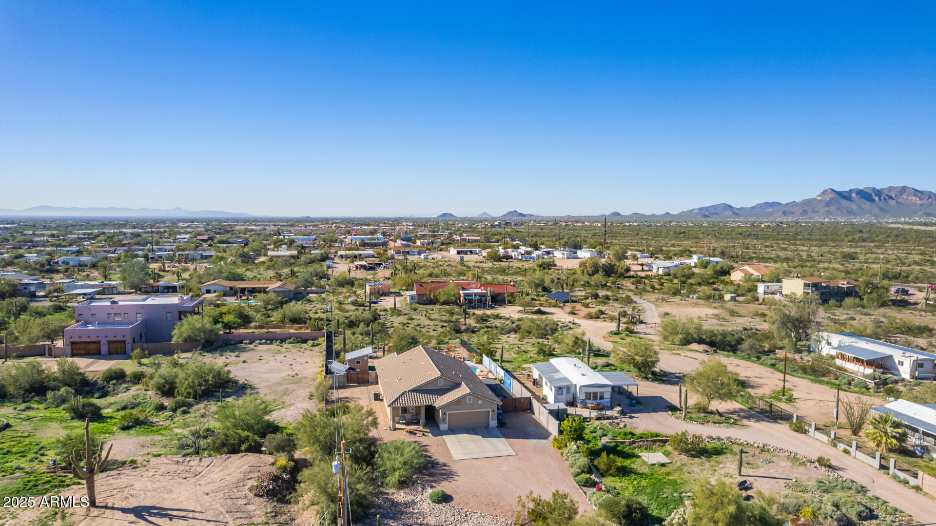 614 North Tomahawk Road Apache Junction, AZ 85119 - Photo 40 of 48 an aerial view of residential houses with outdoor space and trees