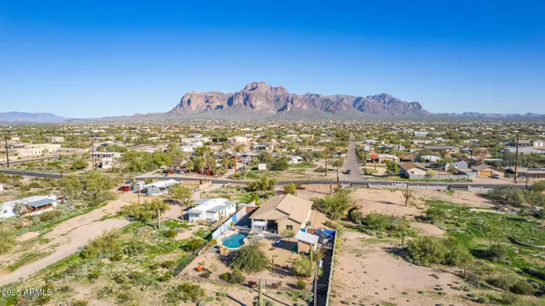 an aerial view of residential houses with city view