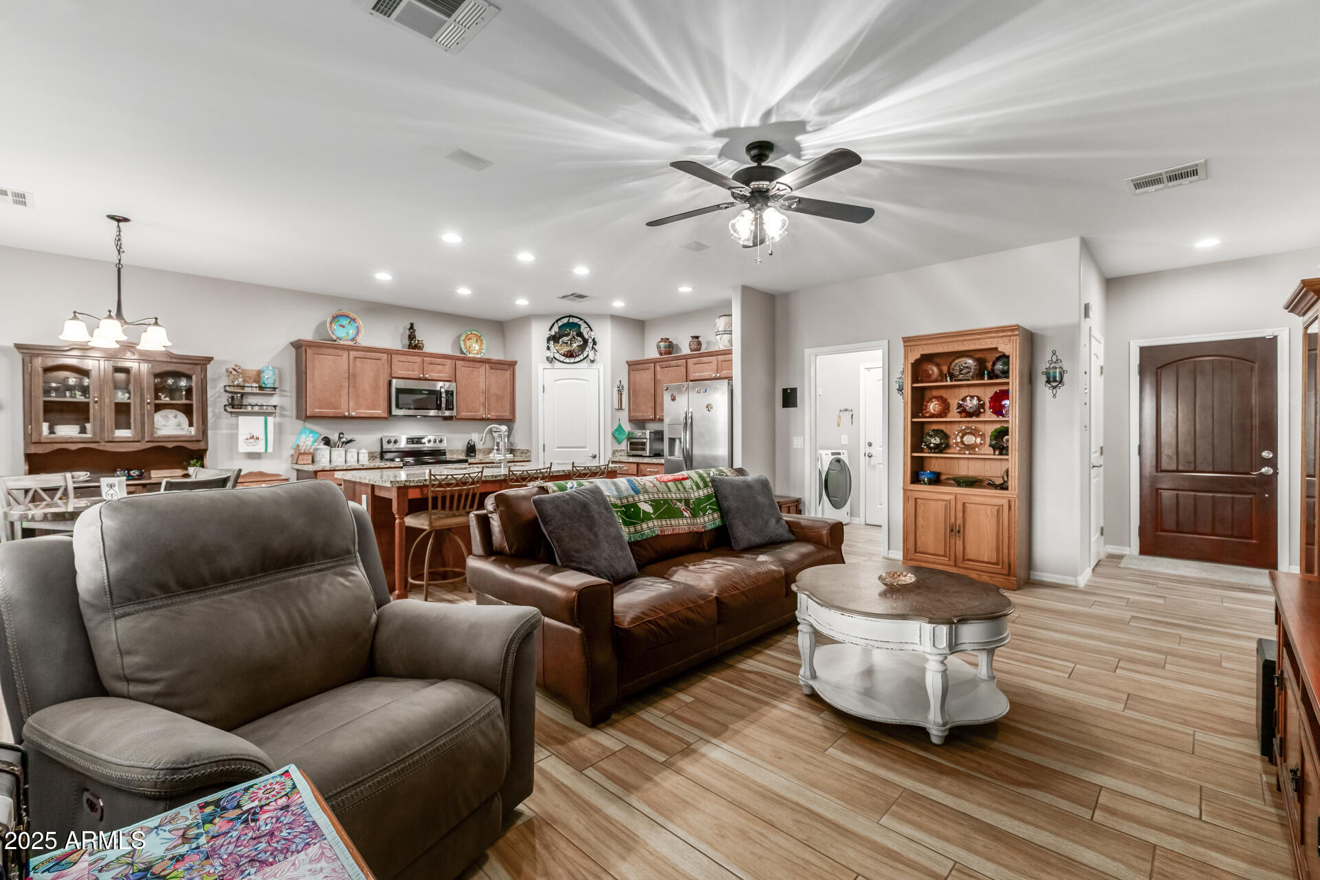 614 North Tomahawk Road Apache Junction, AZ 85119 - Photo 5 of 48 a living room with furniture and kitchen view
