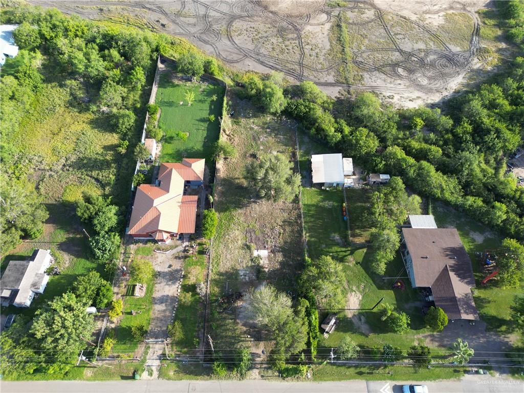 7125 Houston Road Brownsville, TX 78521 - Photo 4 of 9 an aerial view of residential house with outdoor space and trees all around