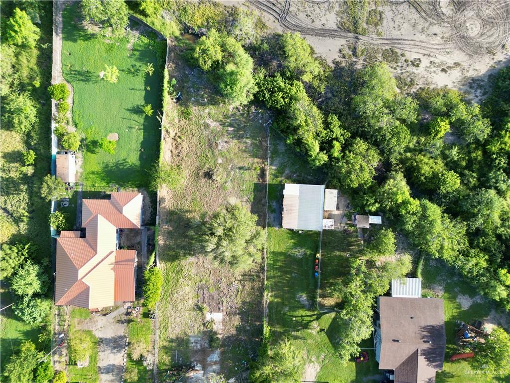 7125 Houston Road Brownsville, TX 78521 - Photo 5 of 9 an aerial view of a house with a yard
