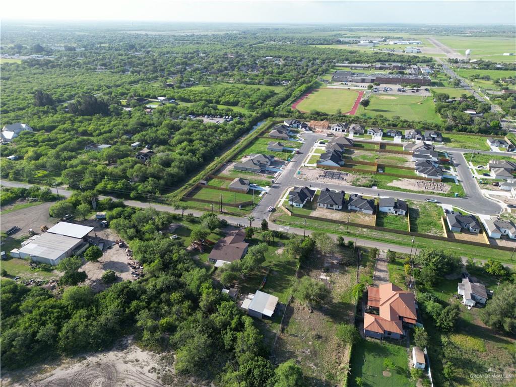 7125 Houston Road Brownsville, TX 78521 - Photo 9 of 9 an aerial view of residential houses with outdoor space and trees