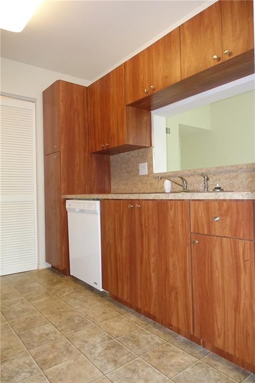 4088 North Pine Island Road, Unit 409 Sunrise, FL 33351 - Photo 4 of 18 a view of a kitchen with an oven