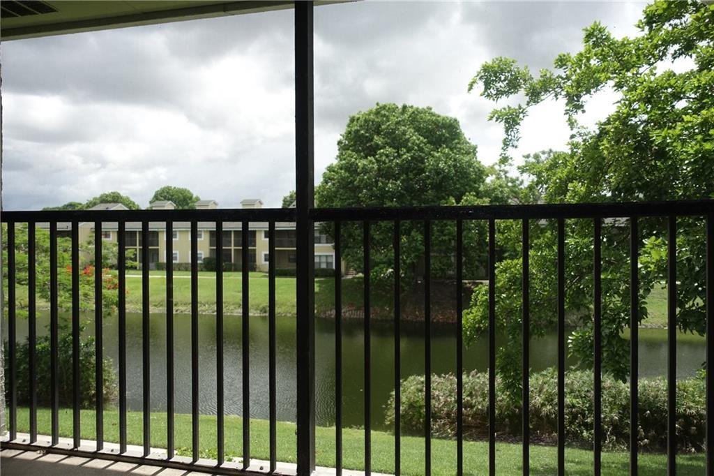 4088 North Pine Island Road, Unit 409 Sunrise, FL 33351 - Photo 9 of 18 a view of a balcony with lake view