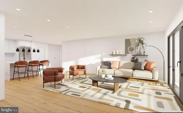 a living room with furniture and a rug