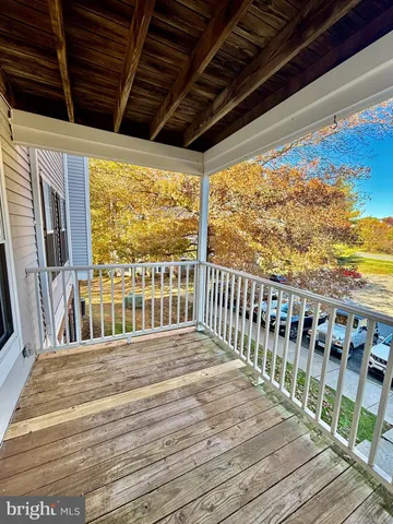 a view of a balcony with wooden floor