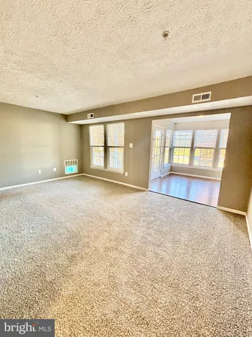 an empty room with large window