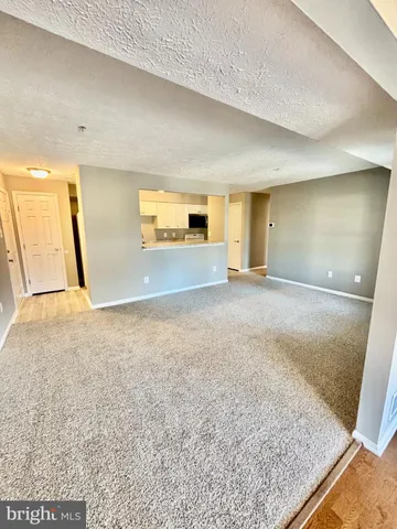 a view of a livingroom with a staircase