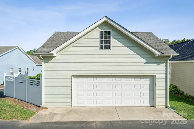 a front view of a house with a garage