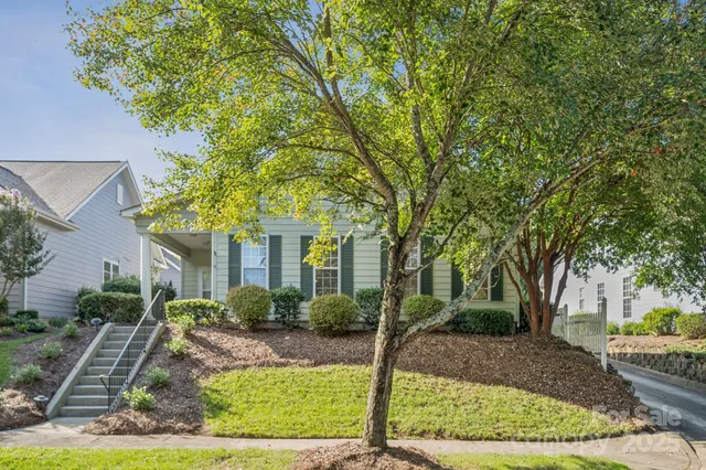 a front view of a house with garden