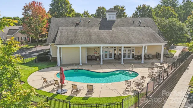 a view of a house with swimming pool