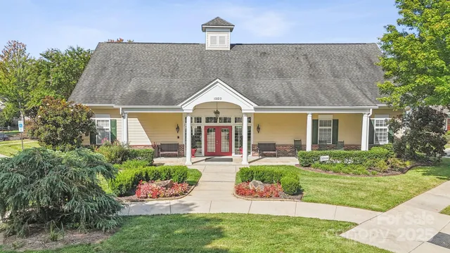 front view of a house with a garden