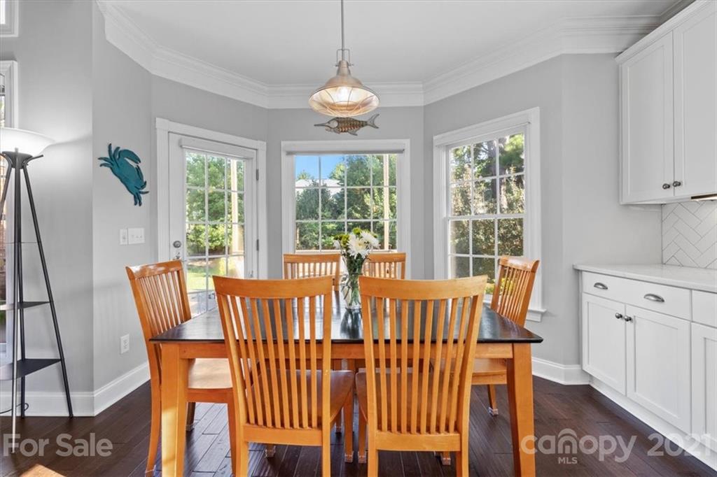 1743 Bentgrass Lane Tega Cay, SC 29708 - Photo 11 of 47 a view of a dining room with furniture window and outside view