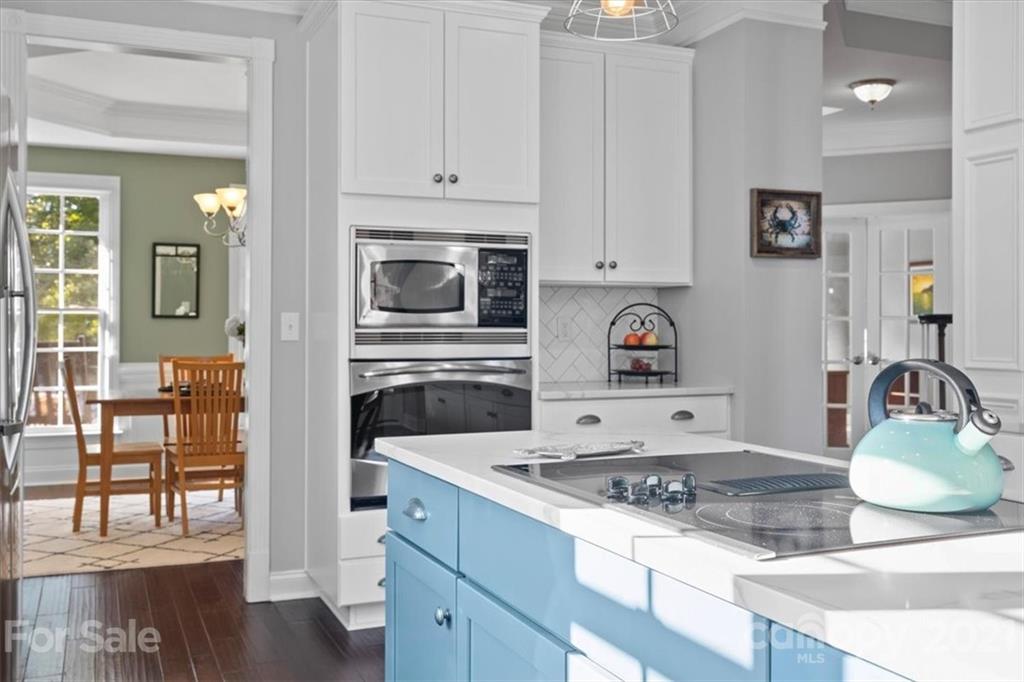 1743 Bentgrass Lane Tega Cay, SC 29708 - Photo 13 of 47 a kitchen with stainless steel appliances granite countertop a stove and a sink