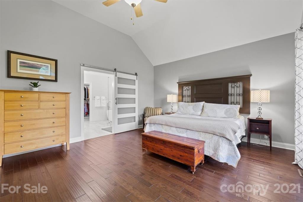 1743 Bentgrass Lane Tega Cay, SC 29708 - Photo 17 of 47 a spacious bedroom with a bed and a dresser