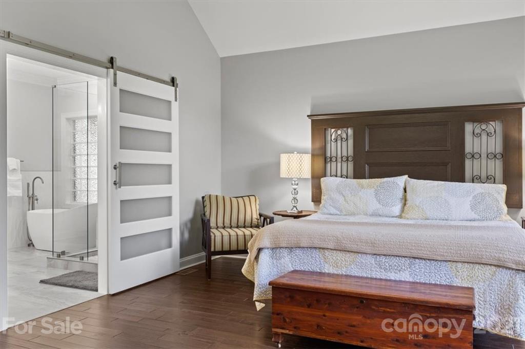 1743 Bentgrass Lane Tega Cay, SC 29708 - Photo 18 of 47 a bedroom with a bed and a dresser