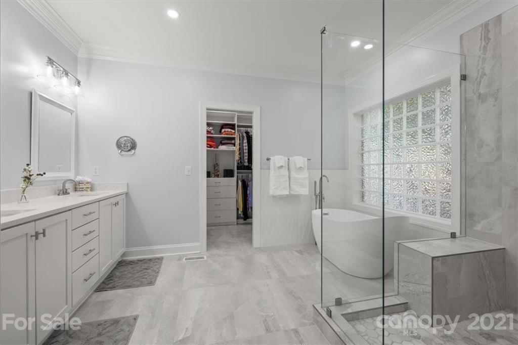 1743 Bentgrass Lane Tega Cay, SC 29708 - Photo 19 of 47 a bathroom with a sink and a mirror