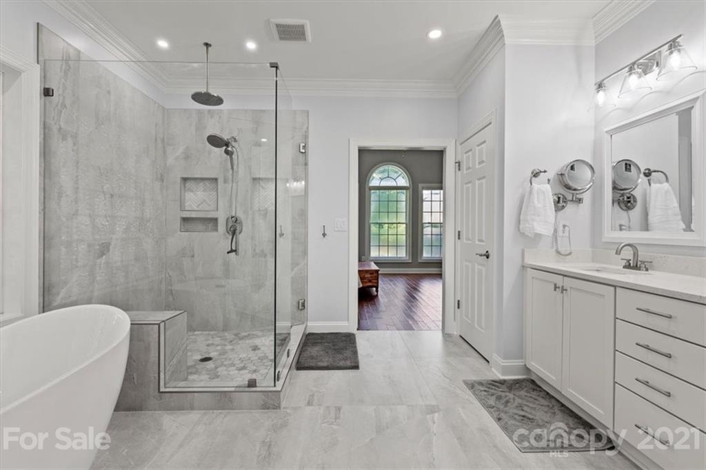 1743 Bentgrass Lane Tega Cay, SC 29708 - Photo 20 of 47 a bathroom with a sink a toilet and shower