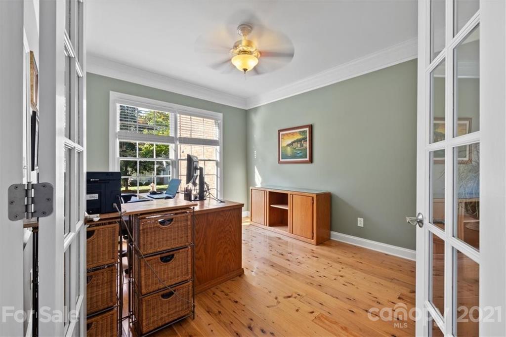 1743 Bentgrass Lane Tega Cay, SC 29708 - Photo 3 of 47 a view of a workspace with furniture and a window