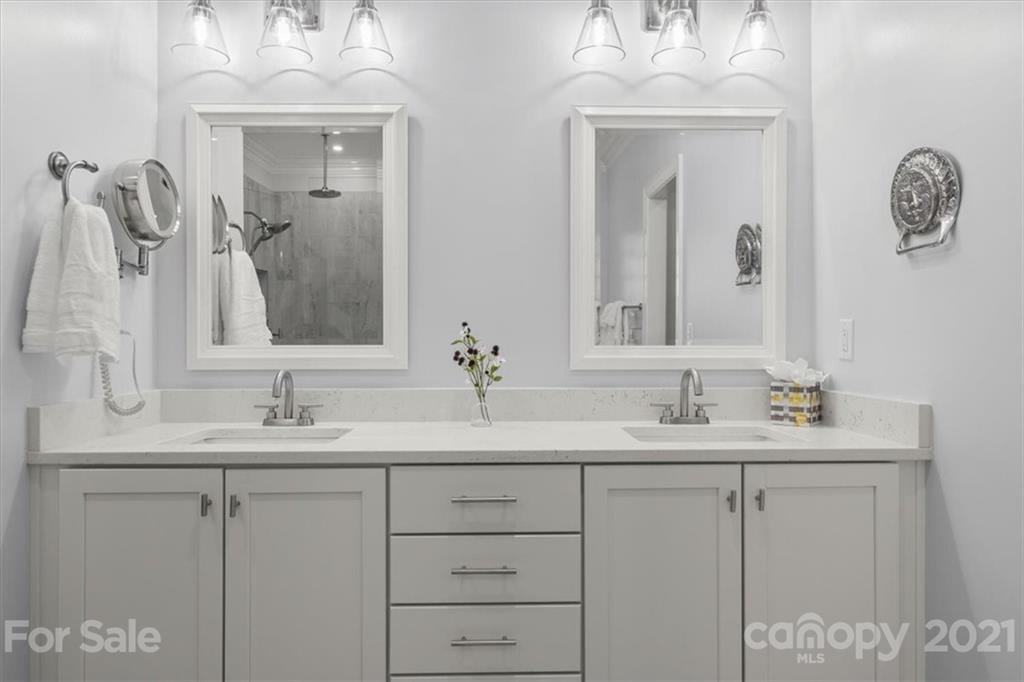 1743 Bentgrass Lane Tega Cay, SC 29708 - Photo 22 of 47 a bathroom with a double vanity sink and a mirror
