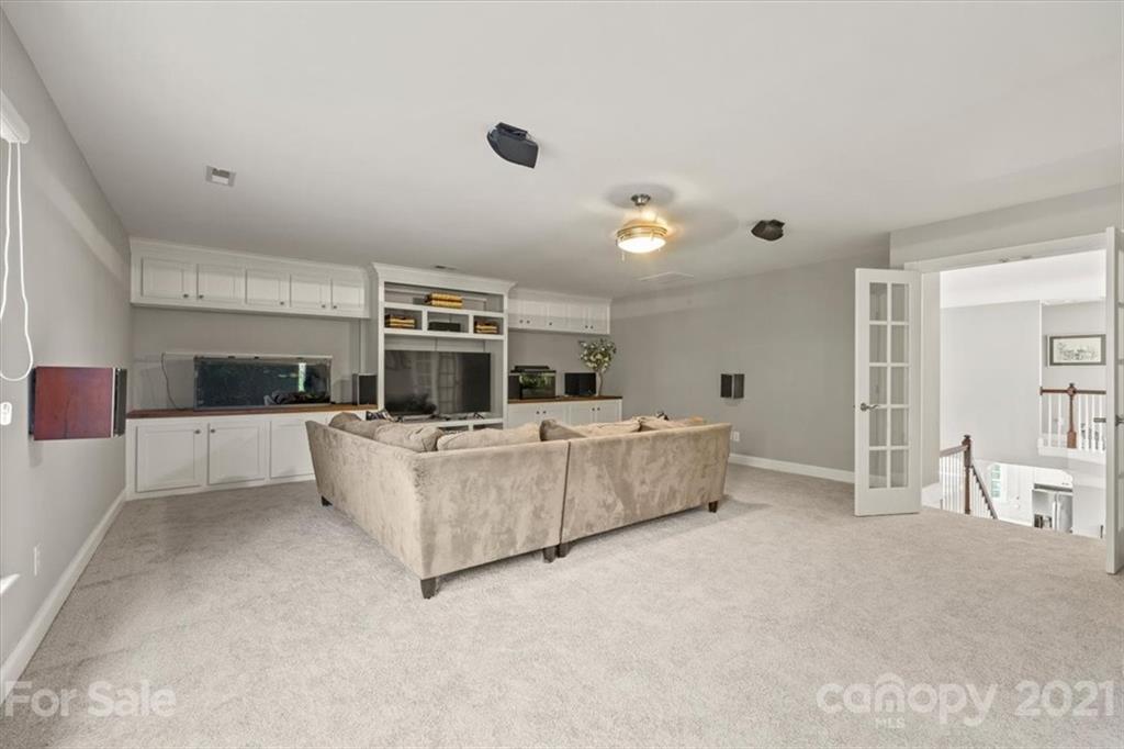 1743 Bentgrass Lane Tega Cay, SC 29708 - Photo 24 of 47 a living room with furniture and a flat screen tv