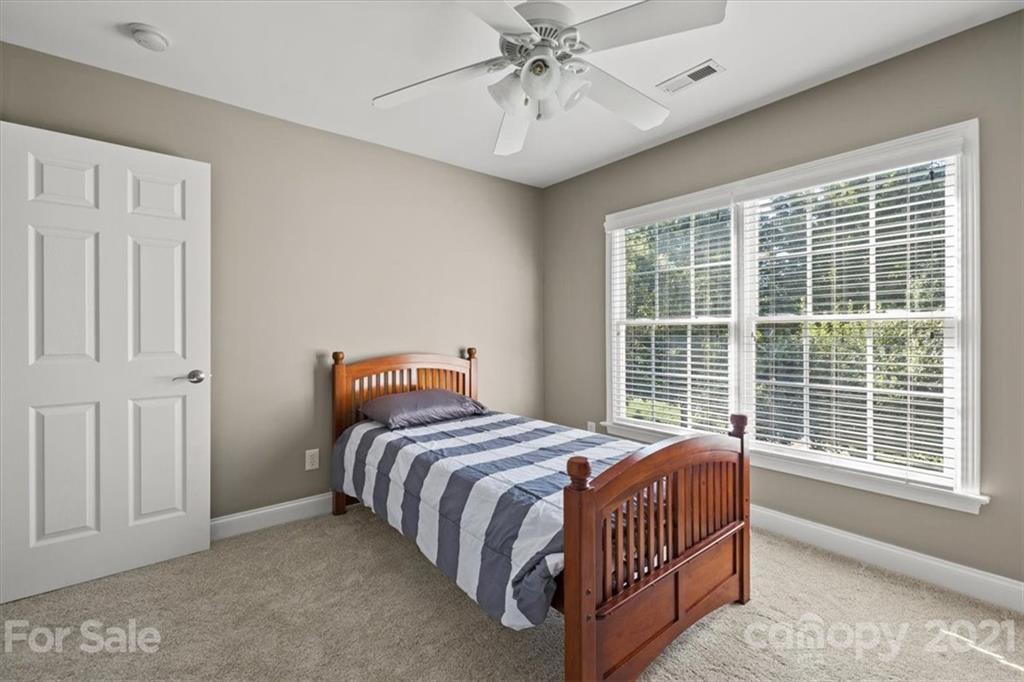 1743 Bentgrass Lane Tega Cay, SC 29708 - Photo 28 of 47 a bedroom with a bed and window