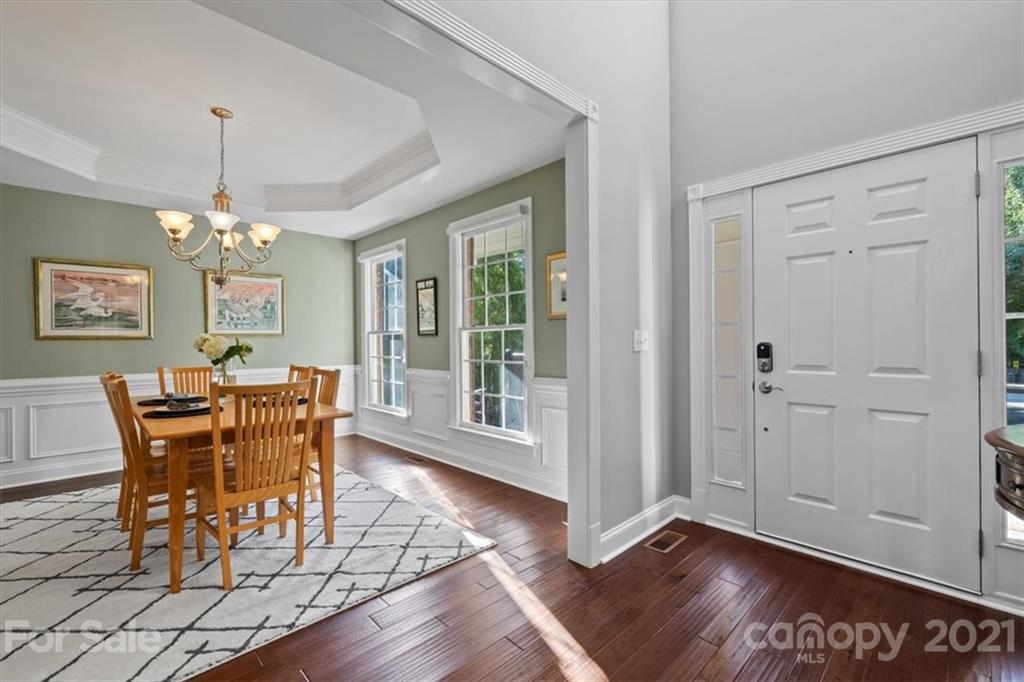 1743 Bentgrass Lane Tega Cay, SC 29708 - Photo 4 of 47 a view of a dining room with furniture window and wooden floor