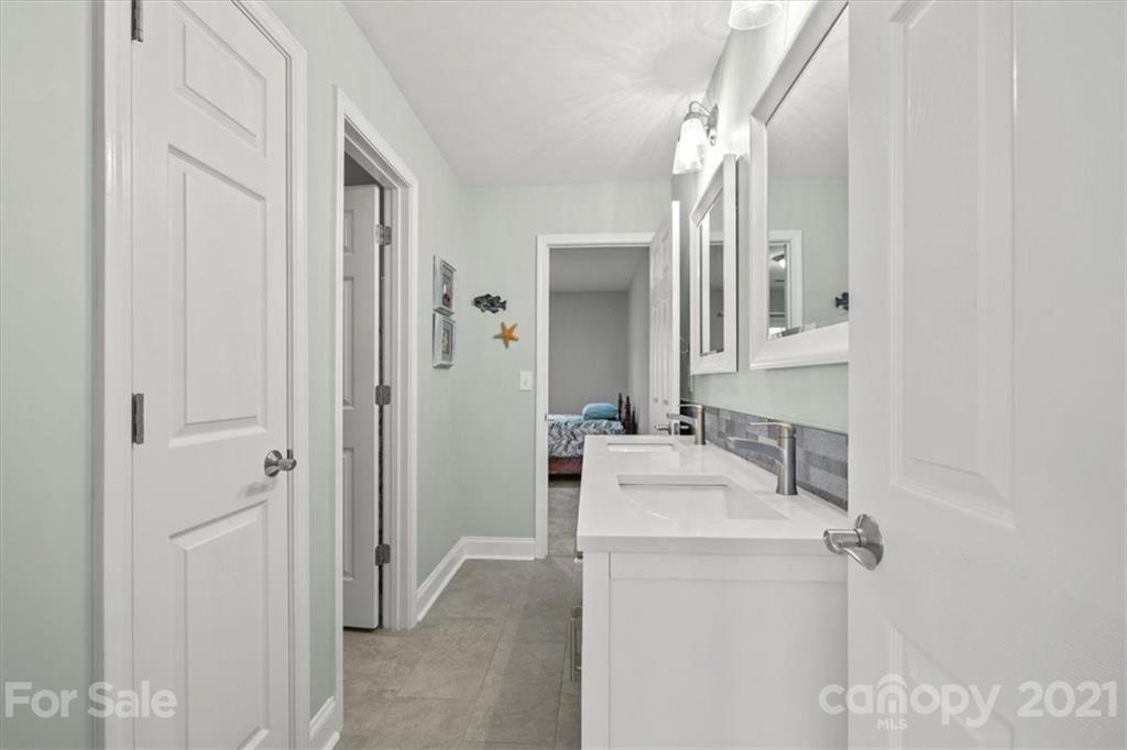 1743 Bentgrass Lane Tega Cay, SC 29708 - Photo 33 of 47 a bathroom with a sink and a mirror