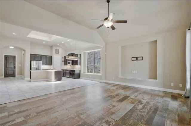 a view of a kitchen with a sink and chandelier kitchen view