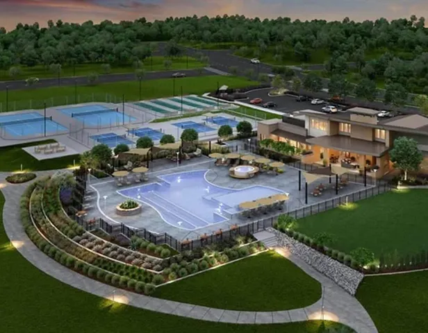 an aerial view of a house with outdoor space