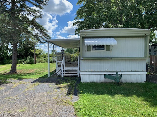 4199 Massillon Road, Unit 223 Uniontown, OH 44685 - Photo 18 of 20 Manufactured / mobile home featuring a front lawn