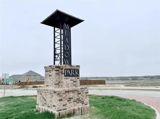 an aerial view of a house with a garden and swimming pool