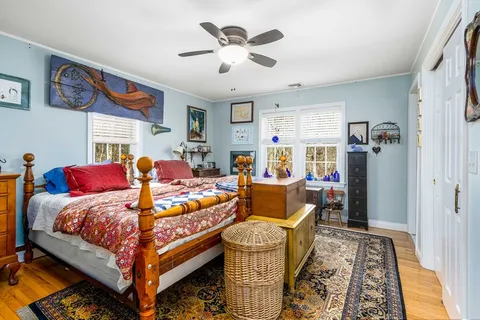 a bed room with furniture and a chandelier