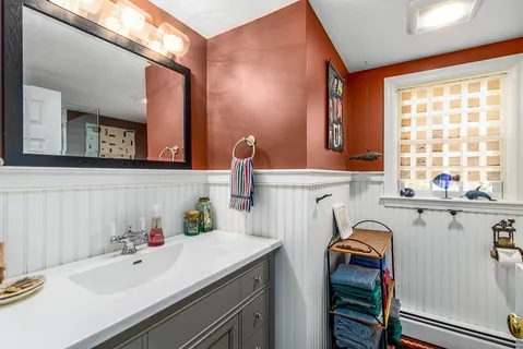 a bathroom with a sink and a mirror