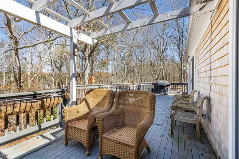 a view of a chairs and table on the deck