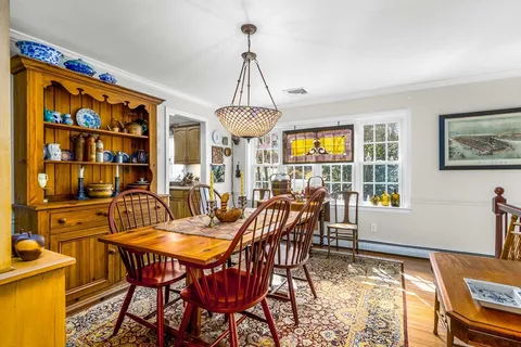 a view of a dining room with furniture window and outside view